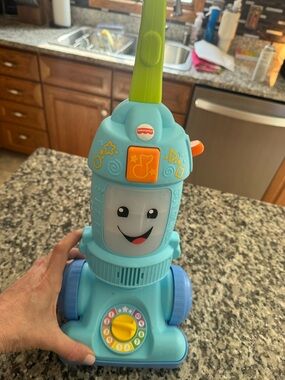 Fisher-Price Light Blue Musical Pretend Vacuum with Green Handle
